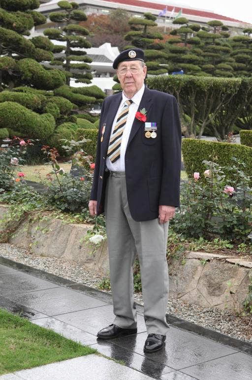 A look at the face of British veteran Terence Page tells of his solemn feelings as he sets out to find the grave of a