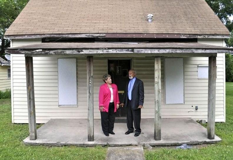 P A G E 5 Ann McCormick, Executive Director of the Carver Birthplace Association, and Dr. Luther S. Williams, Association Chairman, visit the site of the Neosho Colored School on Young Street. Dr. Luther Williams, CBA Chairman of the Board, along with Mr.