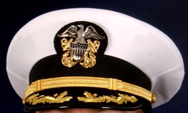 The Admiral, rank Vice Admiral (O-9). The Scrambled Egg is the gold braid found on the cap brim of a senior officer.