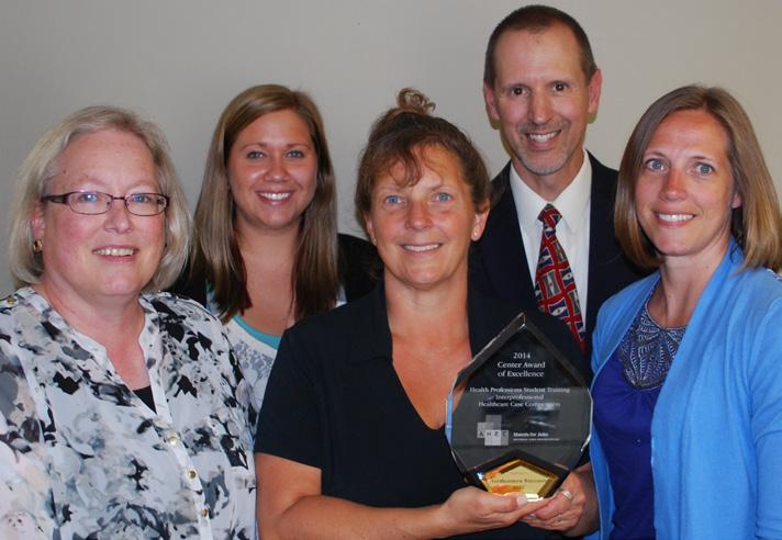 Northeastern Wisconsin Area Health Education Center (NEWAHEC) was one of four organizations to receive a Center of Excellence Award from the National AHEC Organization (NAO) at NAO s biennial