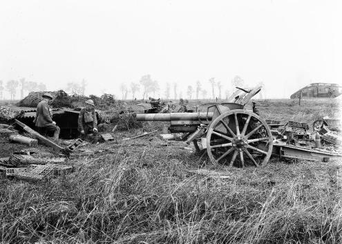 The tank in the last image (AWM E03891) has been knocked out by this gun over open sights, shown. The tank is in background.