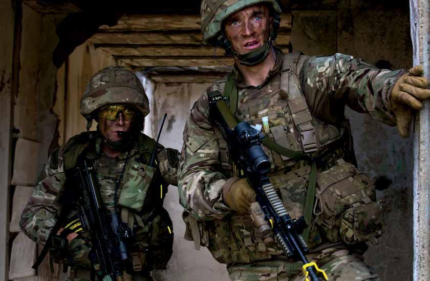 U.S. Marines with Special-Purpose Marine Air- Ground Task Force-Crisis Response Africa and Royal Marines with 45 Commando clear rooms during combined operation part of exercise Blue Raptor in