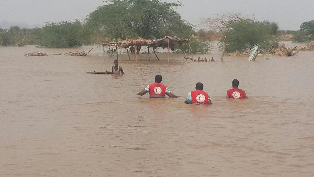 Volunteers wading through flood water to rescue families; El Geizira State, on 11th July 2016, According to respondents Sudan was ranked 2 nd worldwide in terms of disaster occurrences whether man