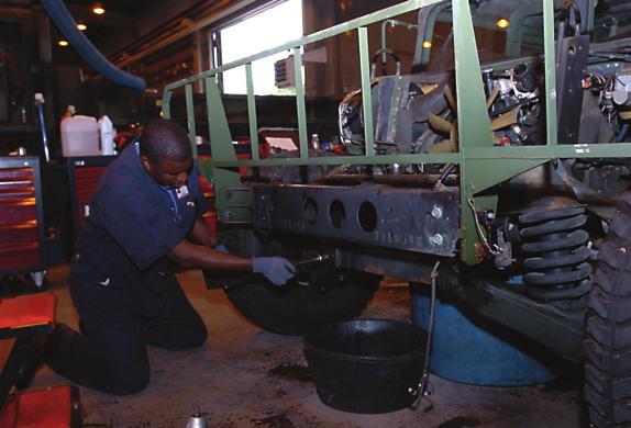 Contracted mechanics under the 21st TSC perform maintenance on left-behind equipment (LBE) from the 12th Combat Aviation Brigade while the unit is deployed.