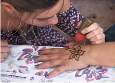 2 generosity of time and leadership Left: Diane Bevilacqua Below: At a fundraising event that celebrates womanhood in many cultures, henna hand painting was an adornment option for attendees who