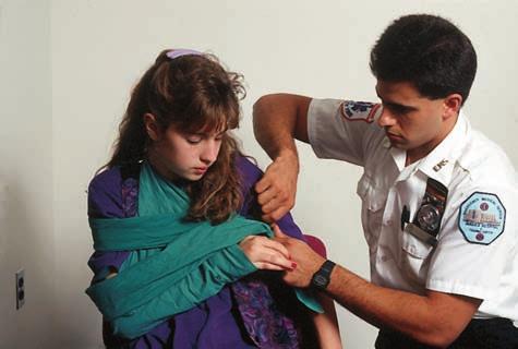 8 Chapter 1 Introduction to Emergency Medical Care I Figure 1-10 An Jones EMT administers & Bartlett treatment Learning, to an injured LLCpatient.