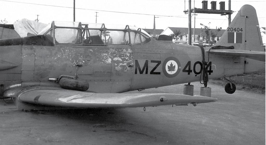 The Yellow Peril by Merrill H. McBride One bent Harvard Mk. IV 20404 as it appeared the day after the night of May 28-29, 1956.