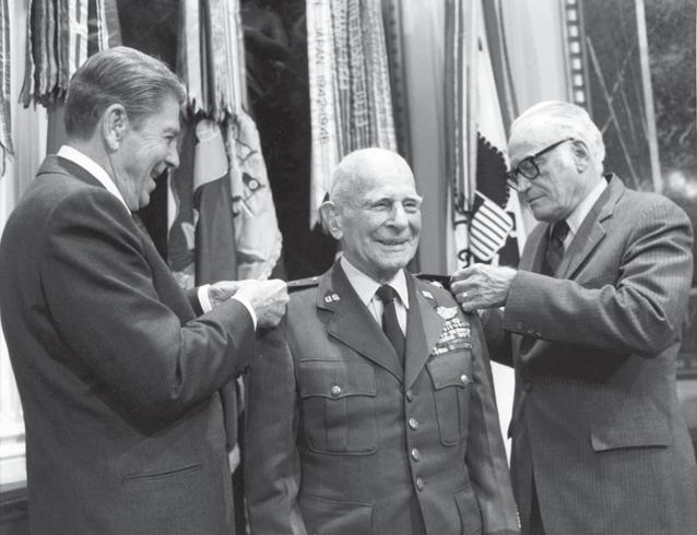White House Photo President Ronald Reagan and Senator Barry Goldwater pin General Doolittle s fourth star on his uniform in a ceremony on April 10, 1985.