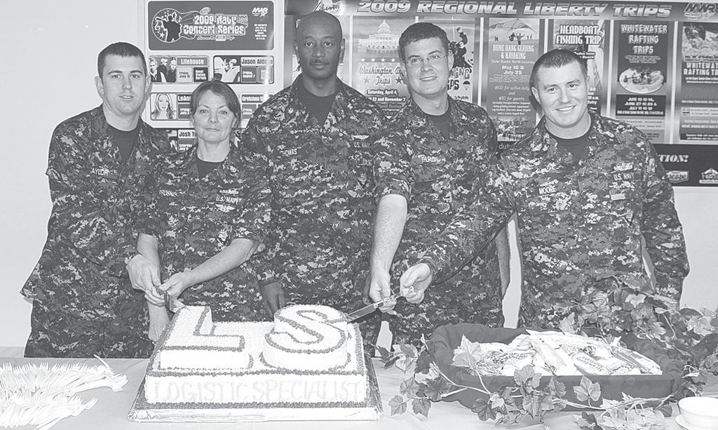 A cake cutting ceremony was held on board the amphibious assault ship USS Kearsarge (LHD 3), to celebrate the new Logistics Specialist (LS) rating.