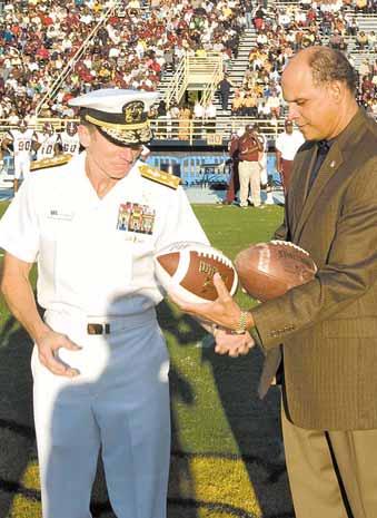 The weekend was highlighted when the Leap Frogs parachuted into Aggie Stadium at North Carolina A&T State University and presented the game ball to Vice Adm.