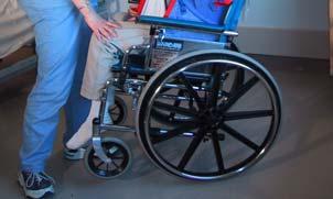 If wheelchair becomes too unstable or tippy when lowering the resident, raise the resident up and realign wheelchair. Lower the resident.