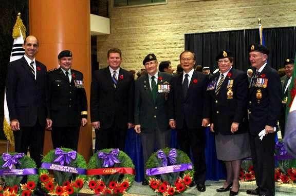 Shown after placing wreaths are (left to right) Honourable Steven Blaney, Minister of Veterans Affairs; Major General Ian C.