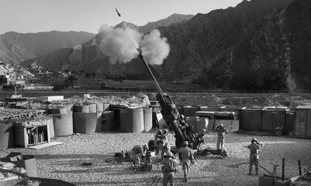 Courtesy of Author Artillerymen fire in support of troops in the Korengal Valley, Konar Province, November 2008.