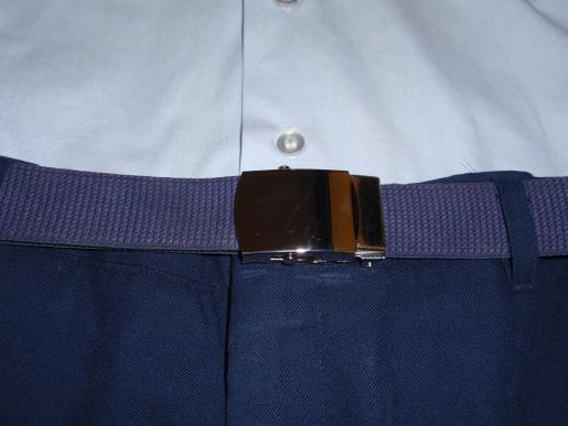 - Females insert the belt into the pants loops going to the right, so that, when fastened, the silver tip is on the