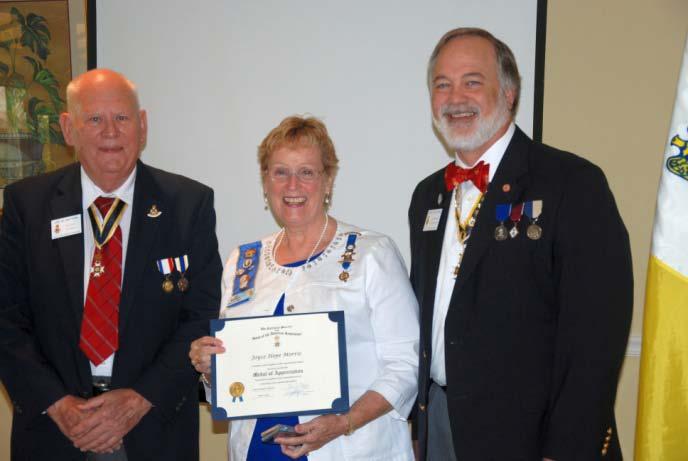 Estero Chapter, NSDAR member Joy Morris is presented the National Society SAR Medal