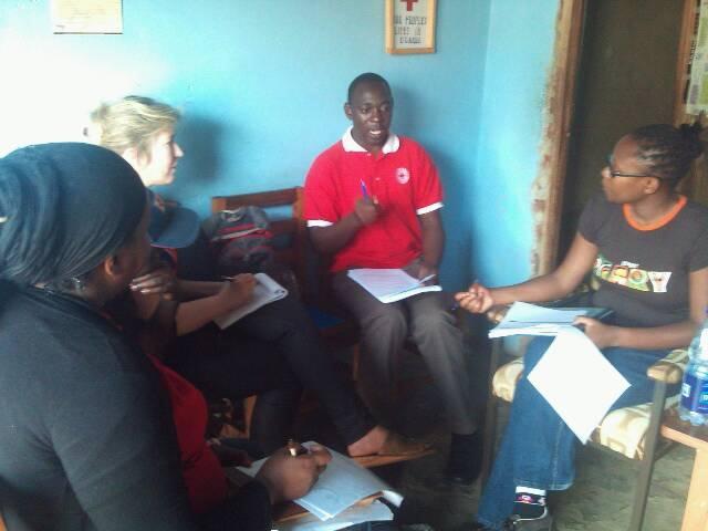 The Kibaale branch manager during interview with IFRC team of evaluators.photo/urcs A group of volunteers during a focus group discussion in Kibaale during the evaluation. Photo/URCS.