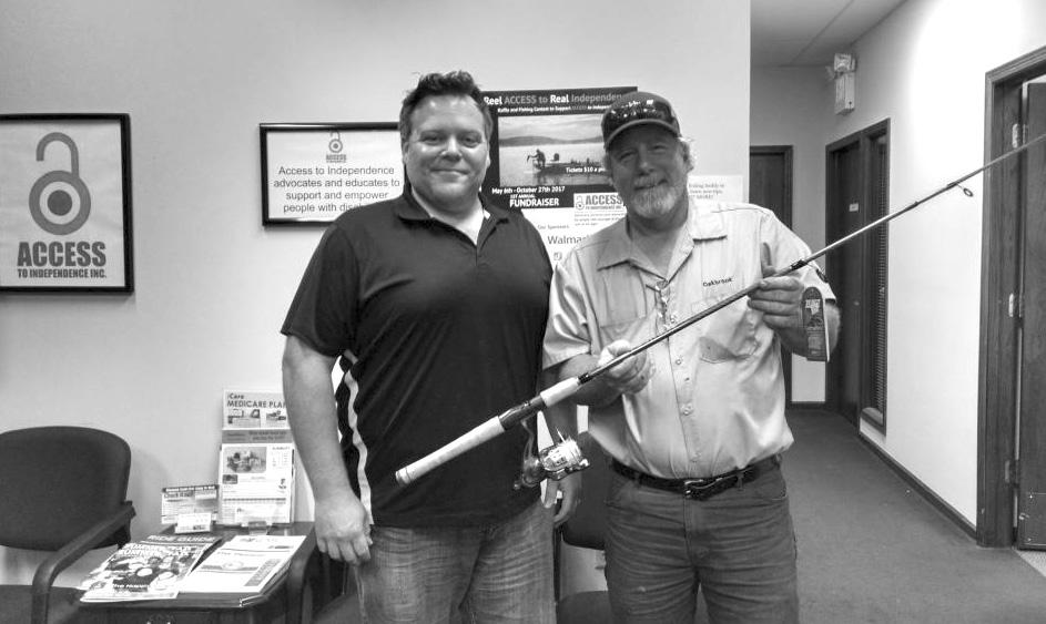 A PUBLICATION OF ACCESS TO INDEPENDENCE INC. Pictured is one of the several raffle prize winners, Jim T, along with ACCESS assistant director, Jason Beloungy. Jim won a rod and reel combo.