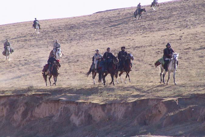 U.S. Special Operations, members of Task Force Dagger, and Afghani forces ride into northern Afghanistan in October 2001 on horseback.