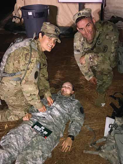 Photo by 1ST SGT. CHRISTOPHER ADKINS From left, Capt. Tracy Morel, Spc. Mary Jones, and Capt. Michael McCaffrie were part of the minority who successfully earned the Expert Field Medical Badge.