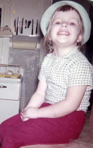 Page 9 WHO AM I? CLUE: In this photo, I m sitting high up on a kitchen table wearing my first hat at La Salle you often see me with my most recent hat or cap, sitting high up as I drive around campus.