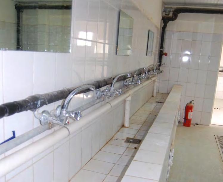 In addition, we found that goose-neck faucets were installed throughout the latrines and dining facilities and that insubstantial shower heads were used in the shower buildings.