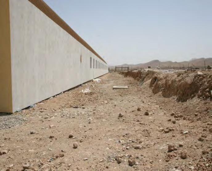 Photo 9: Problematic Grading next to K-Span 3 Source: SIGAR August 4 7, 2010 EFFORTS TO ENSURE SUSTAINABILITY OF MAZAR-E-SHARIF AND HERAT FACILITIES DID NOT OCCUR IN A TIMELY MANNER Although AFCEE