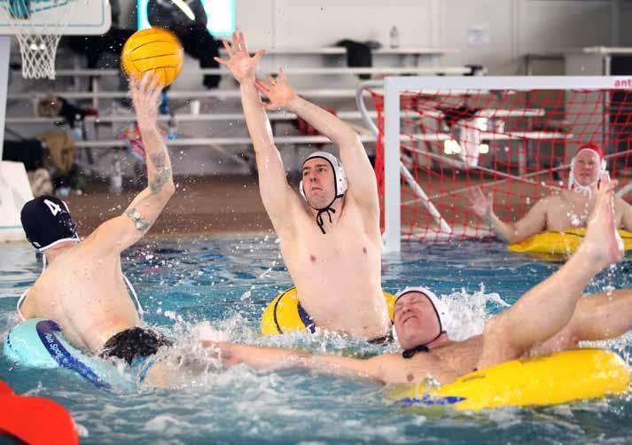 Soldiers participate in water polo, an adaptive sports event. (Photo by Linda Steil) ment of public works, and morale, welfare, and recreation office.