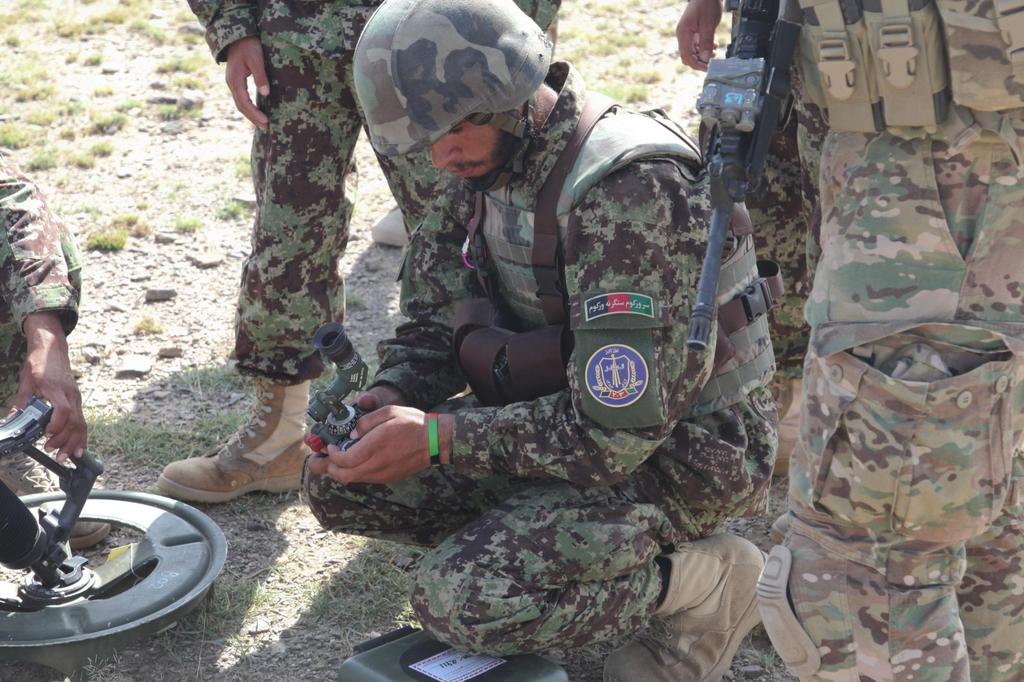 An Afghan National Army soldier from 2nd Khandak, 1st Brigade, 203rd Corps, inspects the sights of a 60mm Mortar Sy
