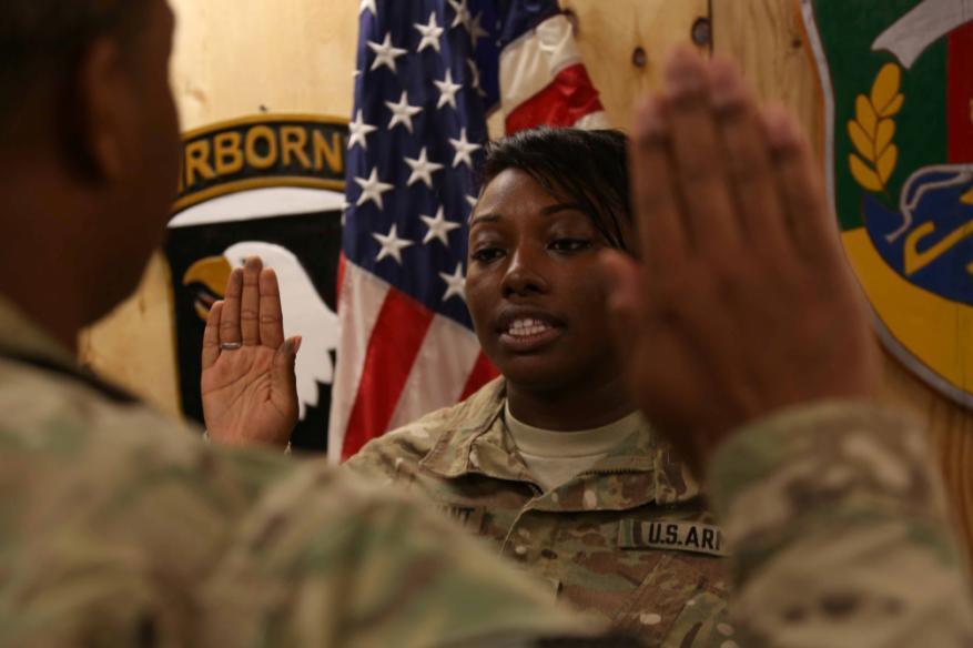 U.S. Army Chief Warrant Officer 2 Chantrelle Sturdivant, Food Service Officer in charge, recites the Warrant Officer Oath during a promotion ceremony at Forward Operating Base