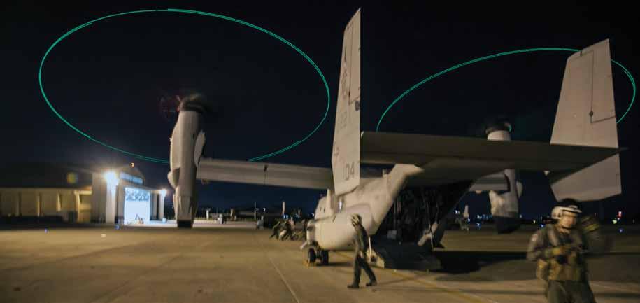 Henry The pilot of the MV-22B Osprey tiltrotor aircraft focuses on guiding the aircraft toward a KC-130J Super Hercules refueling aircraft for aerial refueling.