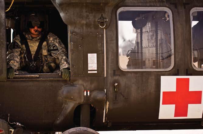 PAGE 14 multi-national Air C On ca (Left) During the initial run up, before taking over the day s from Rio Grande City, Texas, a flight medic in C Company M Air Cavarly Brigade, 1st Cavarly Division,
