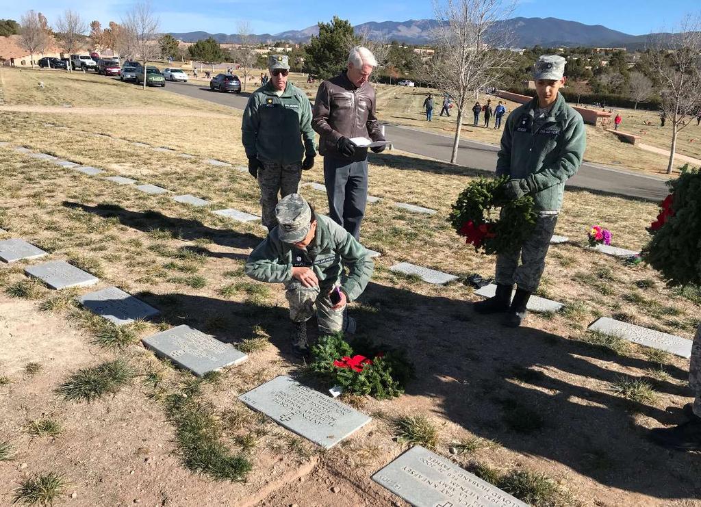 Top: New Mexico Wing Vice Commander-North Annette Peters pauses in silent reflection at the graves of her parents. (Photo: Maj.