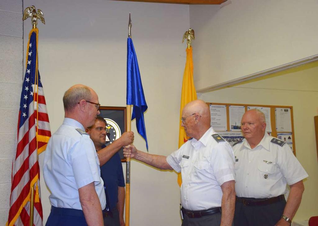 Top: (L-R) As New Mexico Wing commander Col. Mike Lee presides over the change of command ceremony, squadron Aerospace Education Officer 2nd Lt.