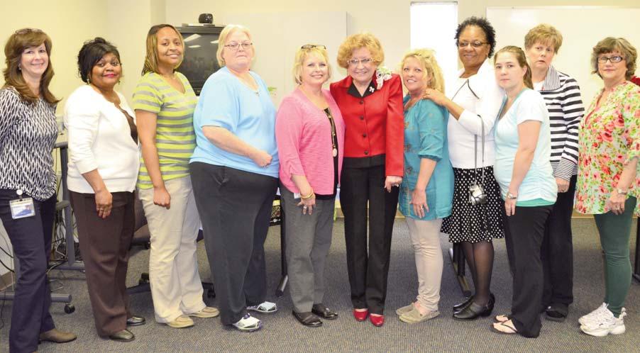 Ramey Retires After 36 Years of Service Coworkers at NMMC s Business Services Center congratulate Judith Ramey (center) on her retirement in March after 36 years of service.