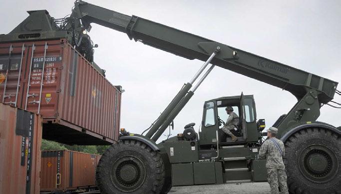 TRAINING & EDUCATION Army Reserve Soldiers from the 236th Inland Cargo Transportation Company use a Kalmar container handler to download shipping containers of ammunition at a railhead at the Drawsko
