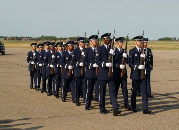 two individuals in the middle. The individual on the right carries the Nation's flag and the other carries the Air Force flag. This tradition dates back to the origins of warfare.