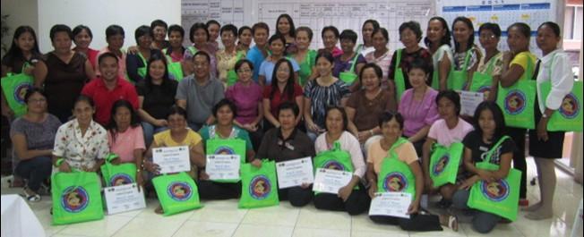 The graduates with their certificates and CHT home visiting bags during the commencement for CHT training.