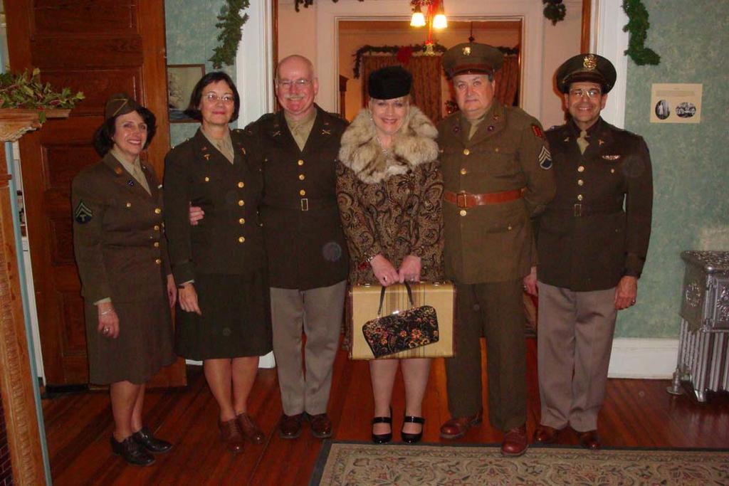 As the evening ends, some members of AGFA pose for a final picture inside History House in celebration of a 1943 Christmas at Fort Hancock.