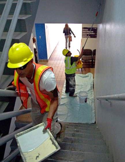 Contractors paint walls as part of the repairs to the Bayamón Police Command Center.