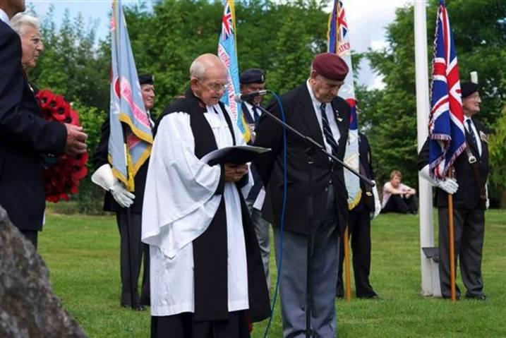 5 In the photographs below on the left are Reverent Tony Wood and BKWVA Chairman Frank Fallows paying respect to the Fallen as Reverend Wood recites a prayer and on the right are