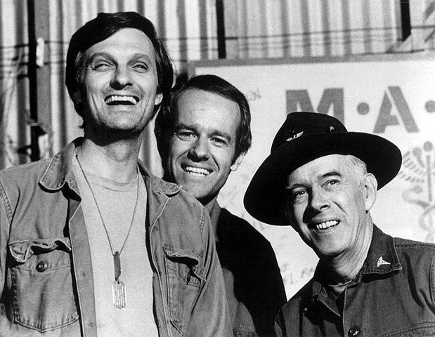Publicity photo of some cast members from the television show M*A*S*H in 1975: Alan Alda (as Captain Benjamin Franklin