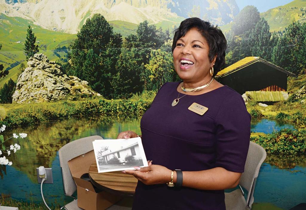 NEWS Cheryl (Jackson) Leysath, Exceptional Family Member Program manager, looks at a picture of the 1970s-era Army Community Service building she worked in 40 years ago.