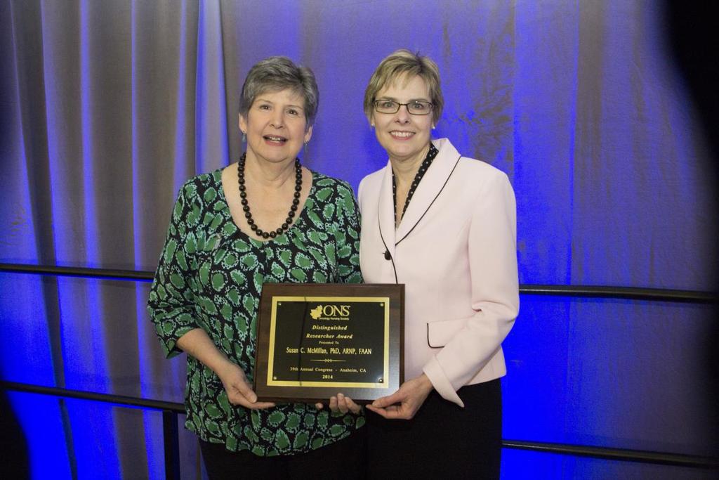 Susan McMillan, PhD, ARNP, FAAN, (left) receiving the 2014 ONS Distinguished Researcher Award from Paula Rieger, RN, MSN, CAE, FAAN, chief executive officer, ONS, at ONS annual Congress, May 1, 2014.