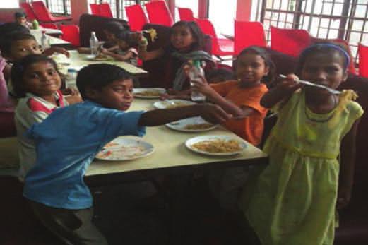 Key elements of the program include nutritious hot meals for the children, along with preschool education and games.