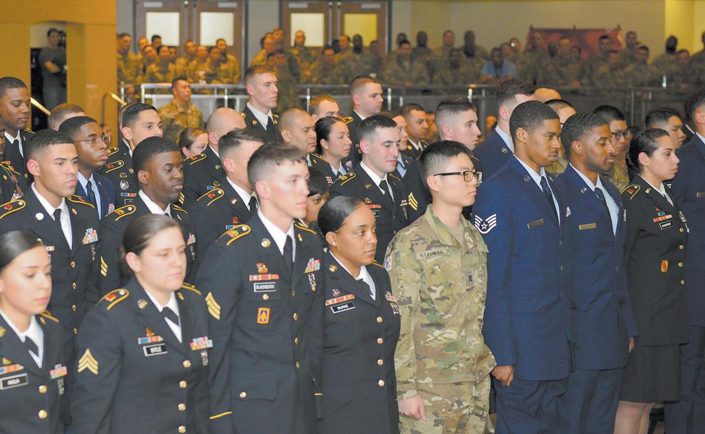 , for serving as the guest speaker during the joint NCO induction ceremony Feb. 16 at Osan Air Base. (Left) Soldiers, Korean augmentees to the U.S. Army and Airmen assigned to 35th ADA Bde.