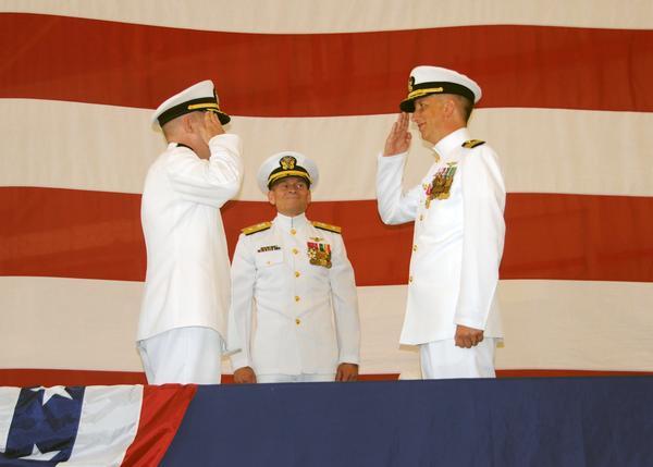 Capt. Robert Caldwell (left) assumes command of Fleet Readiness Center Southeast from Capt. Paul Sohl (right) as Rear Adm.