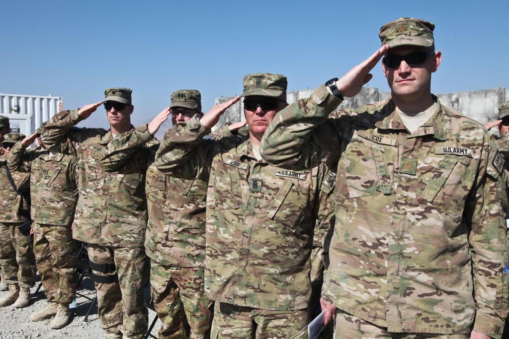 U.S. Soldiers salute to the American flag in Forward Operating Base Shank, Oct. 20, 2012, in Logar province, Afghanistan.