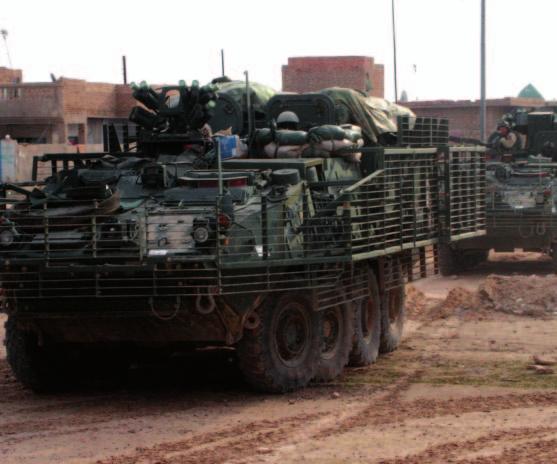 Stryker vehicles from 3rd Bridgade, 2nd Infantry Division, position themselves in Samarra, a town northwest of Baghdad in December 2003. (U.S. Army photo by SGT Jeremy Heckler.