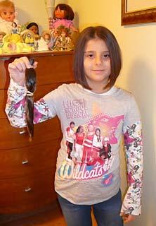 school yard. They also raised money selling white ribbons for ending violence against women. St. Elizabeth Student Donates Hair Cristina Iamascia of St.