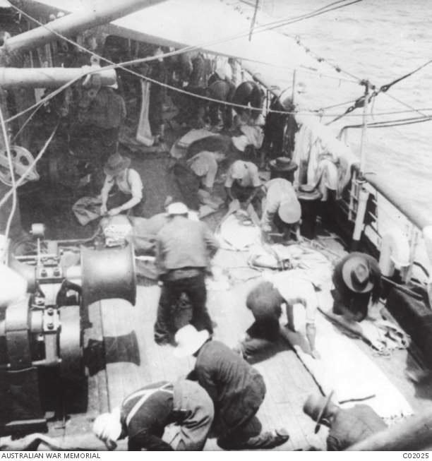 At Sea: January 915, Soldiers spread their bedding out to air on the deck of the transport HMAT Themistocles, which was part of the second